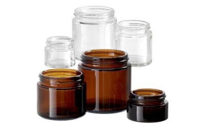 An image of several Simplicity Glass Jars that are both clear and amber in different sizes